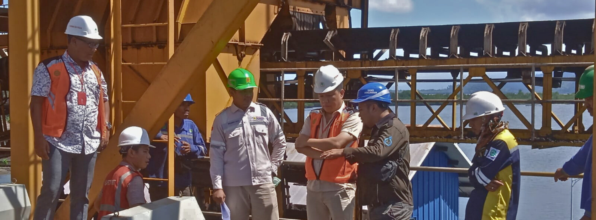 Industrial electrical panels with an engineer inspecting them.