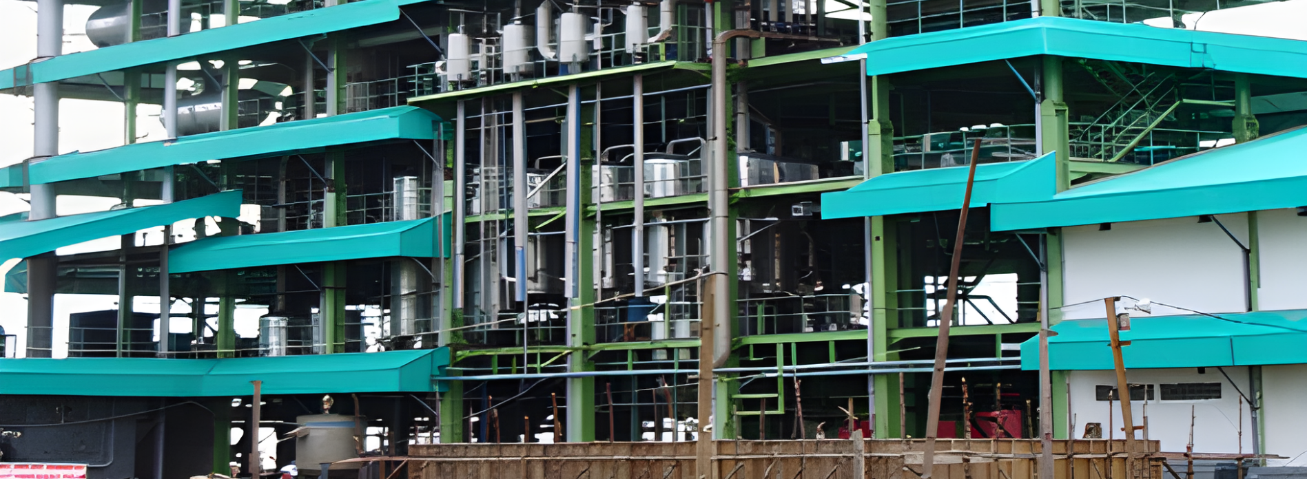 Industrial electrical panels with an engineer inspecting them.